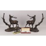 Two bronze animalier figure groups of stags, 20th century, modelled on bases with tree stumps,