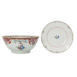 A Chinese export porcelain bowl and dish, 18th century, each painted with floral sprays, 22.5cm