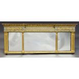 A Regency gilt triple plate over mantle mirror, the frieze with applied spheres and anthemion and