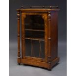 A late Victorian walnut and marquetry inlaid music cabinet, the rectangular top with three quarter