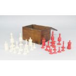 A bone and red stained bone chess set, 19th century, in a later box, the kings 10.5cm highPlease