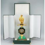 A gilt metal and malachite mantel clock, of recent manufacture, the case mounted with a large bird