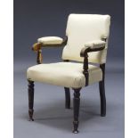 A stained oak and cream leather upholstered armchair, late 19th, early 20th Century, with square