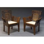 A Pair of Burmese/Anglo Indian hardwood chairs, early 20th Century, with overall carved foliate