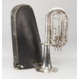 A silvered metal Besson horn, in a case, lacking mouthpiece, 64cm highPlease refer to department for