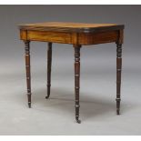 A William IV Mahogany and line strung tea table, the fold over top with reeded edge, above line