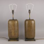 A pair of metal rectangular lamps, of recent design, with wicker covered bodies, on square bases,