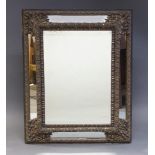 A Dutch brass repousse work wall mirror, late 19th Century, of rectangular form, with repousse