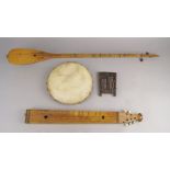 An African nail lute, 20th century, 16cm long, together with a tambourine and two stringed