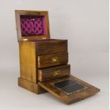A Victorian walnut jewellery box, the top with stepped domed lid, lifting to reveal a purple