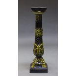 A green & black majolica pedestal, 20th century, with foliate moulded column, on square base,