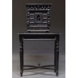 An ebonized carved oak table cabinet, 19th Century, decorated with carved figures, with an