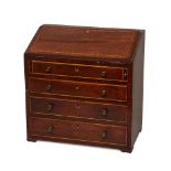 A George III mahogany and boxwood strung miniature bureau, late 18th/early 19th century, the fall-