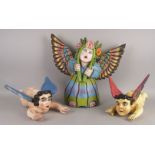 A Mexican painted wood female angel, of recent manufacture, 43cm high, together with two similar