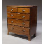 A Regency mahogany chest of drawers, with two short over three long drawers, above serpentine shaped
