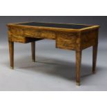 A Louis XV style walnut bureau plat, early to mid 20th Century, the rectangular top inset with black