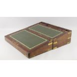 A Victorian brass bound writing slope, the interior with green tooled leather writing surface,