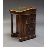 A Victorian rosewood Davenport, the fall front top inset with green leather surface, enclosing two