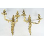 Three Louis XV style gilt-bronze twin-light wall appliques, early 20th century, 40cm high,