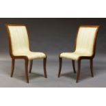 A pair of continental mahogany side chairs, second half 20th Century, with curved backs, the seat