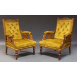 A pair of Edwardian walnut button back armchairs, the serpentine crest rail with carved wheat