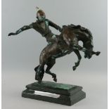 A bronze model of a Mongolian horseman, of recent manufacture, modelled riding a bucking stallion,