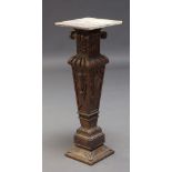 A Victorian carved walnut pedestal, the square white and purple marble top above Ionic capital