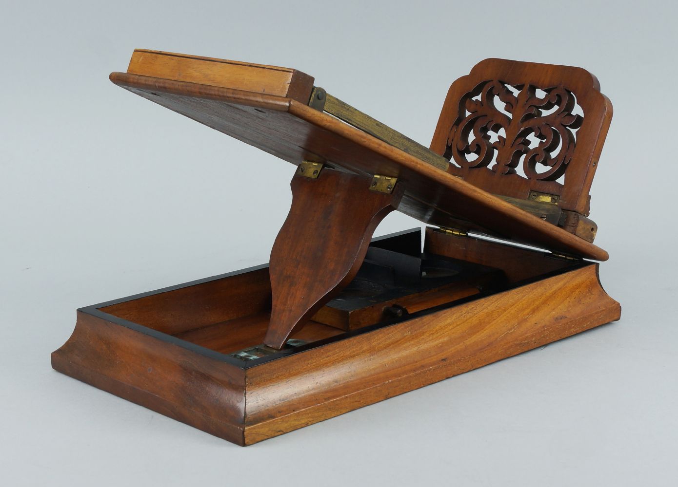 A walnut stereoscope viewer, late 19th/early 20th century, the top with a pierced sliding card