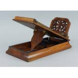 A walnut stereoscope viewer, late 19th/early 20th century, the top with a pierced sliding card