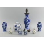 A pair of miniature Chinese porcelain Canton vases, 20th century, decorated with lotus, birds and