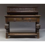A carved oak buffet by Liberty, London, early 20th Century, the raised back carved with fruiting