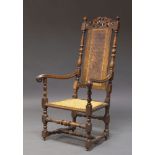 A William and Mary style high back armchair, 19th Century and later, the carved and pierced crest