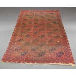 A large Tekke woollen carpet, early 20th century, decorated with elephant medallions, 288 x 214cm, a