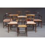 A harlequin set of seven dining chairs, to include a pair of Regency mahogany bar back chairs, a