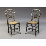 A pair of Victorian ebonised and mother of pearl inlaid side chairs, the pierced spoon-shaped backs,