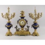 A French taste gilt metal and blue enamel clock garniture, mid/late 20th century, the clock