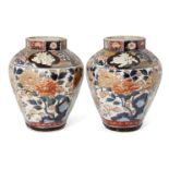 A pair of Japanese Arita porcelain octagonal vases, 17th century, painted in the imari palette