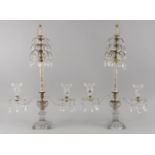 A pair of cut glass and gilt metal mounted two branch candelabra, 19th century, with pineapple