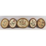 Four Victorian oval crewel work embroidered pictures of sprays of flowers, 22.5 x 16.5cm, together