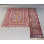 An Afghan rug with floral design in deep blue field and multiple borders, 212cm x146cm , together