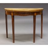 A George III mahogany and inlaid demi-lune tea table, the fold over top with chevron inlaid