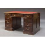 A mahogany pedestal desk, late 20th Century, the rectangular top inset with red leather writing