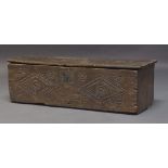 An elm plank coffer, late 17th, early 18th Century, with carved initials 'E.L' and dated '1709', the