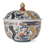 A large Japanese imari porcelain circular tureen and cover, 19th century, painted with panels of