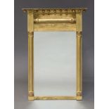 A Regency style gilt mirror, early 20th Century, the breakfront cornice, above applied spheres,