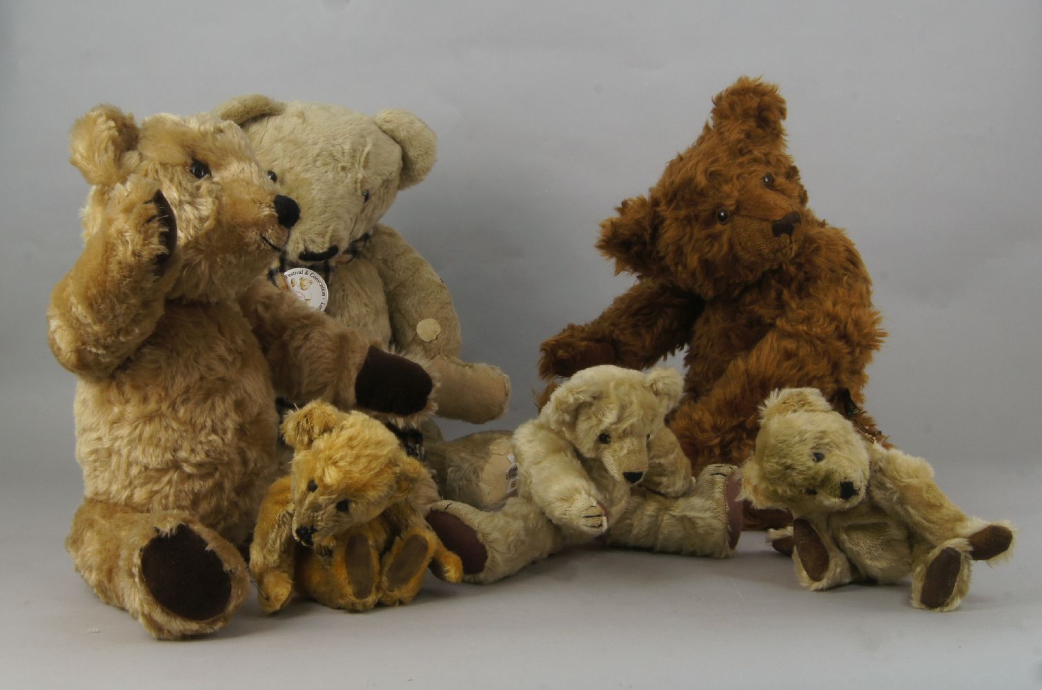 A teddy bear by Howell, applied with a label, Bears that are special, 53cm high, together with a