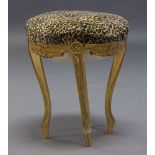 A Louis XV style giltwood stool, late 19th early 20th Century, the circular seat upholstered in