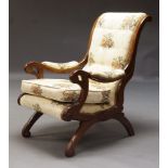 A William IV style mahogany armchair, 20th Century, upholstered in cream and floral pattern