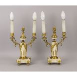 A pair of white marble and gilt bronze two light candelabra, 19th century, with central flaming