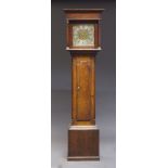 An oak longcase clock, late 18th, early 19th Century, with dentil moulded cornice above plain